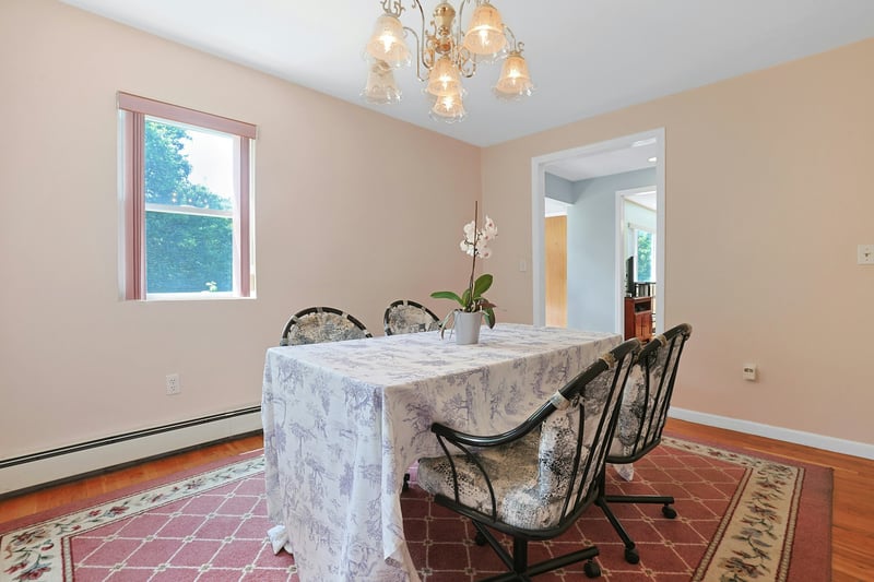 Dining room with a chandelier, wood finished floors