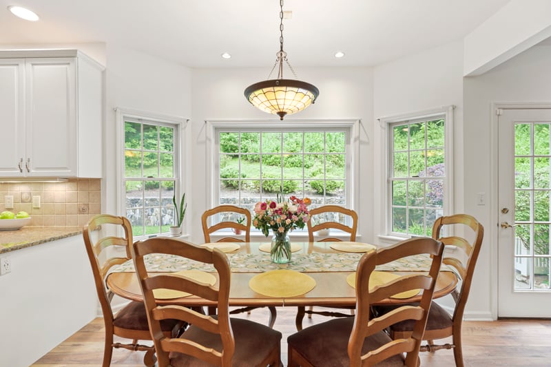 Dining space featuring light wood finished floors and recessed lighting