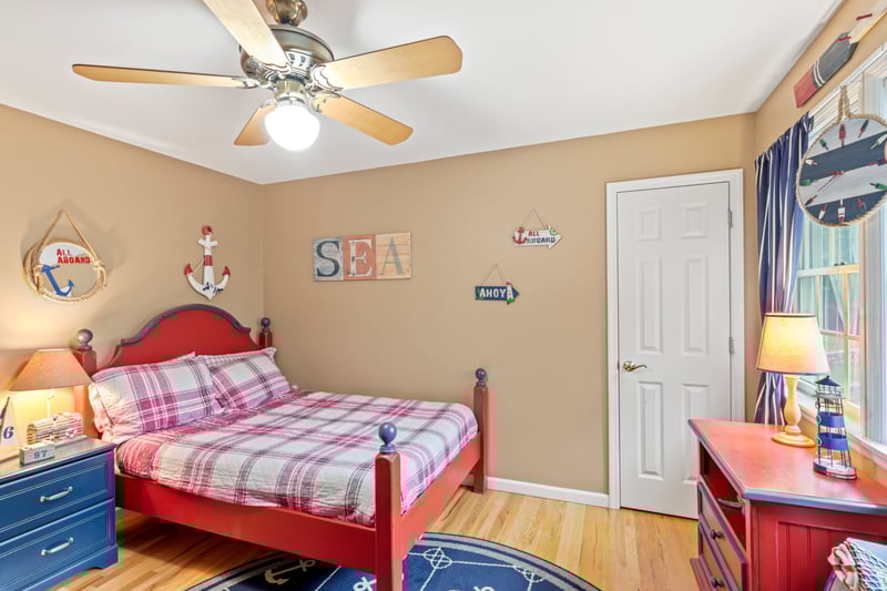 Bedroom featuring light wood-style flooring and ceiling fan