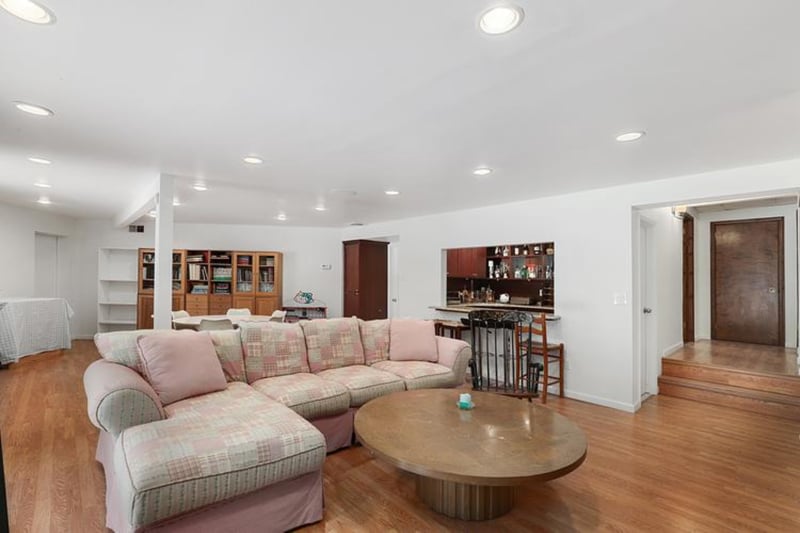 Living area featuring light wood-type flooring and recessed lighting