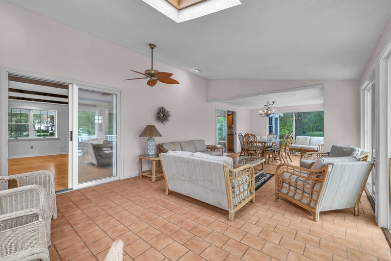 This expansive sun porch is accessible through the kitchen or the family room.