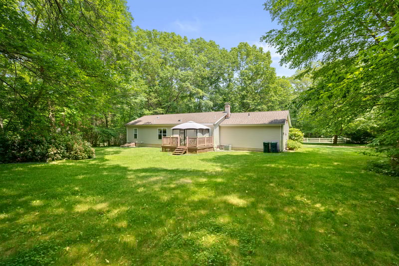 Sprawling back yard adjacent to Old Lyme Land Trust