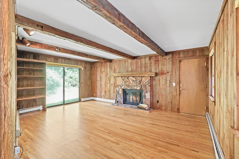 Alternate View of the Family Room with sliders to the back and access to the garage.
