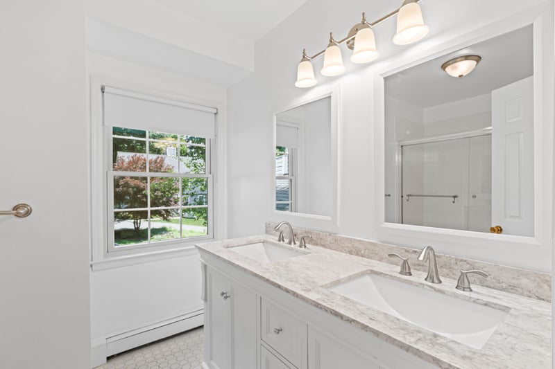 Bathroom featuring plenty of natural light and double vanity