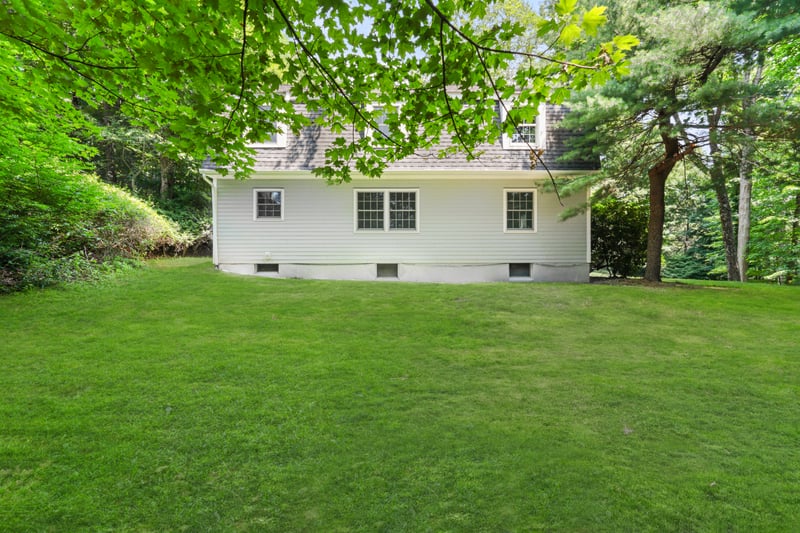  Side view of property with a yard