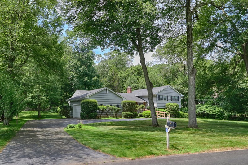 View of driveway and large two car garage.