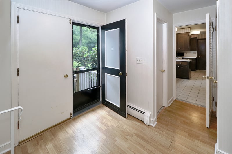 Front entry with double doors leading to foyer.