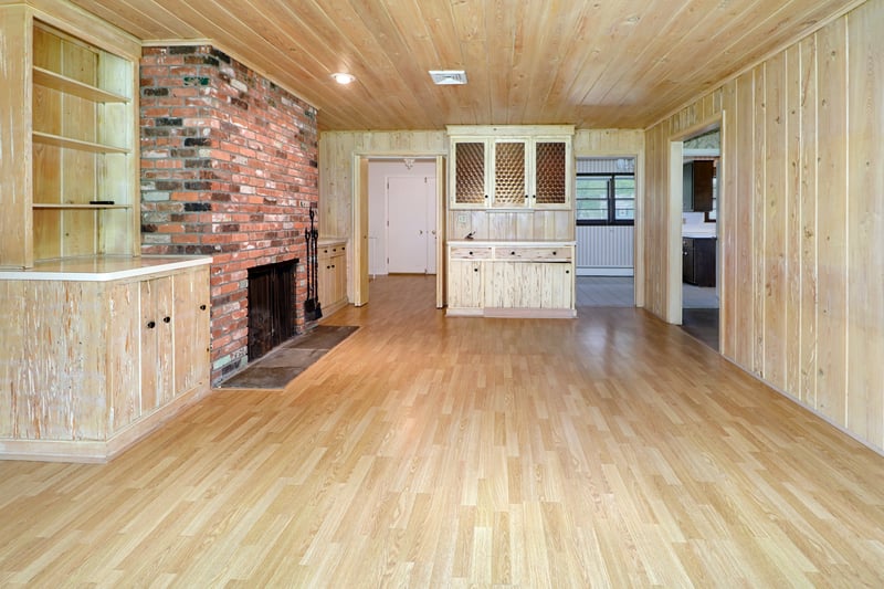 Alternate view of family room with multiple built-ins and access to kitchen and dining rooms.