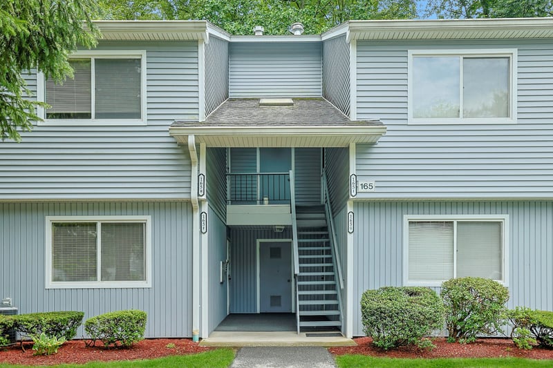 View of front of property featuring well maintained landscapping...