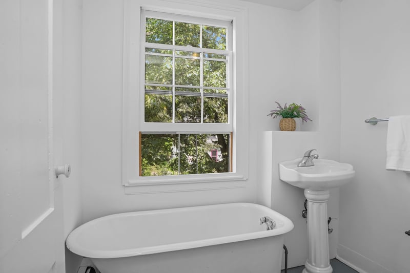 Full Bathroom with clawfoot tub and pedestal sink