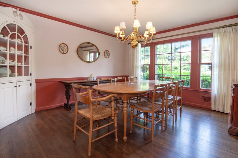 The formal dining room features an original built-in china cabinet, and classic crown molding.