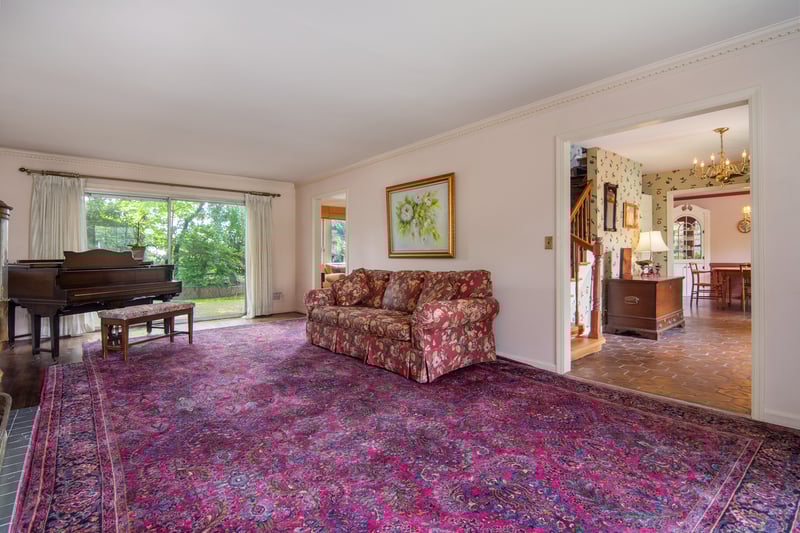 A generously sized living room provides the perfect backdrop for entertaining on any scale.