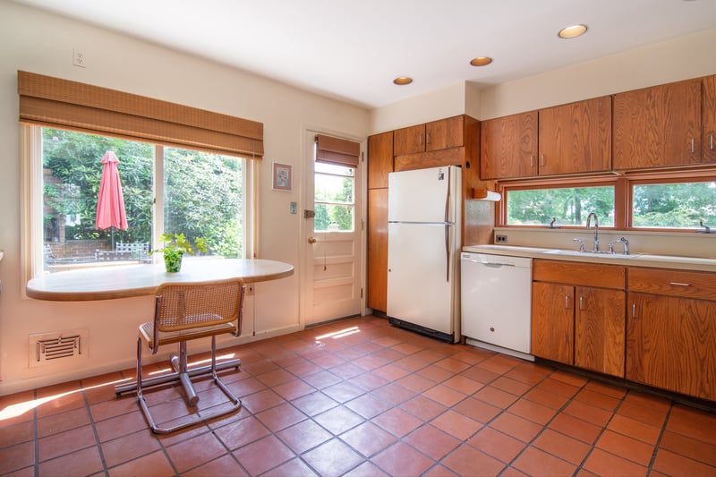The kitchen also offers space for casual dining and convenient access to the backyard.