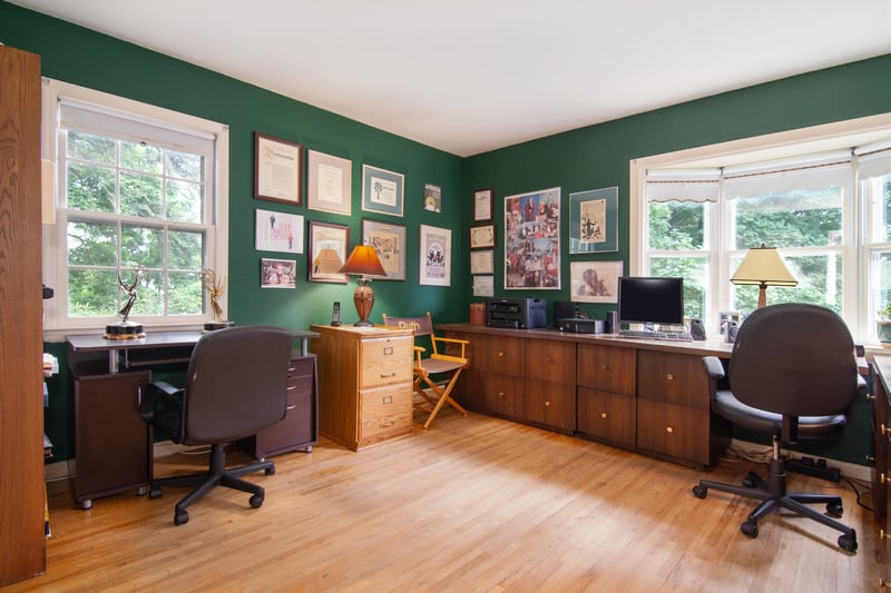 Converted into a personal office, the fourth bedroom offers a glimpse into the remarkable career of its late owner - with captivating photos, memorabilia and even two Emmy Awards!