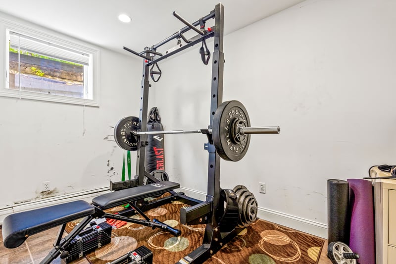 Another finished room in the basement currently used as the weight room