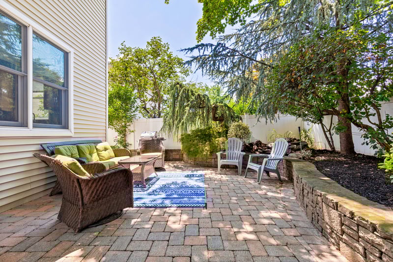 Fenced backyard with an outdoor living space and pavered patio area