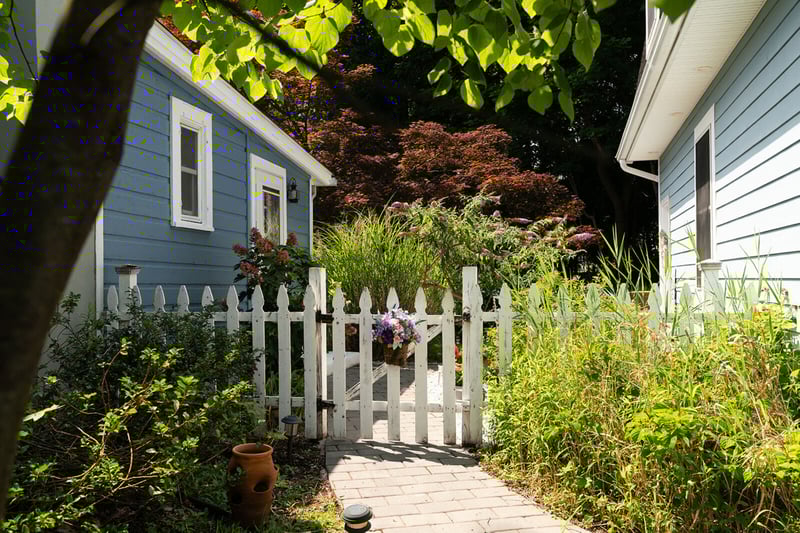 15 / 21View of home's exterior featuring a gate