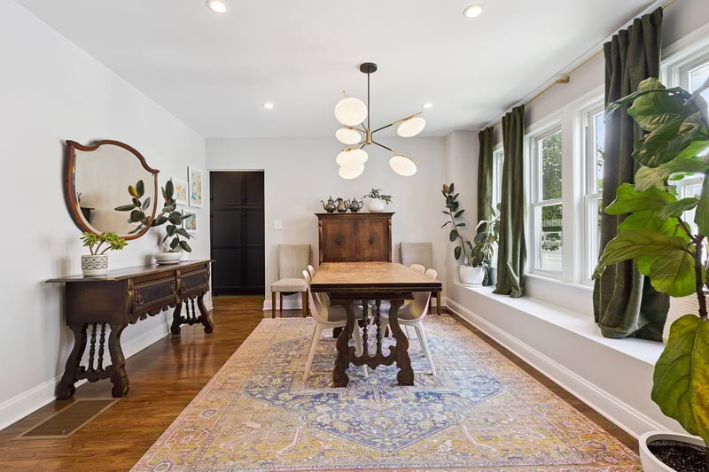 Dining area featuring dark wood finished floors, a chandelier, and recessed lighting...