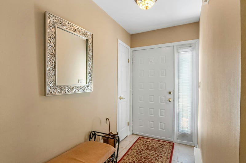 Entry way featuring light tile flooring