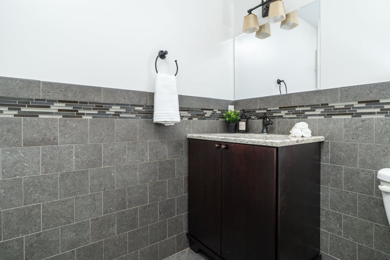 Powder room with vanity and toilet