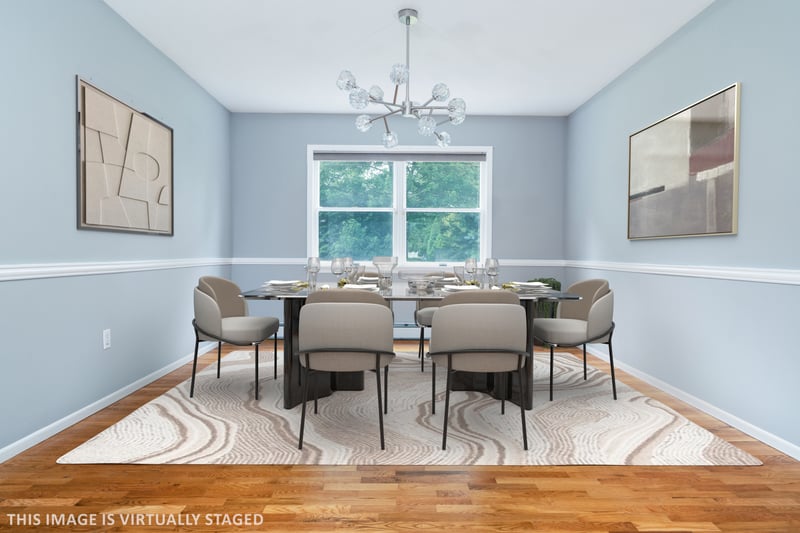 Dining area featuring a chandelier and wood finished floors