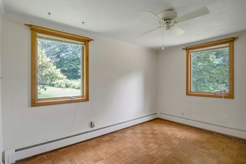 Spare room with baseboard heating, crown molding, and a ceiling fan...