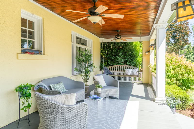 Porch featuring an outdoor living space and ceiling fan