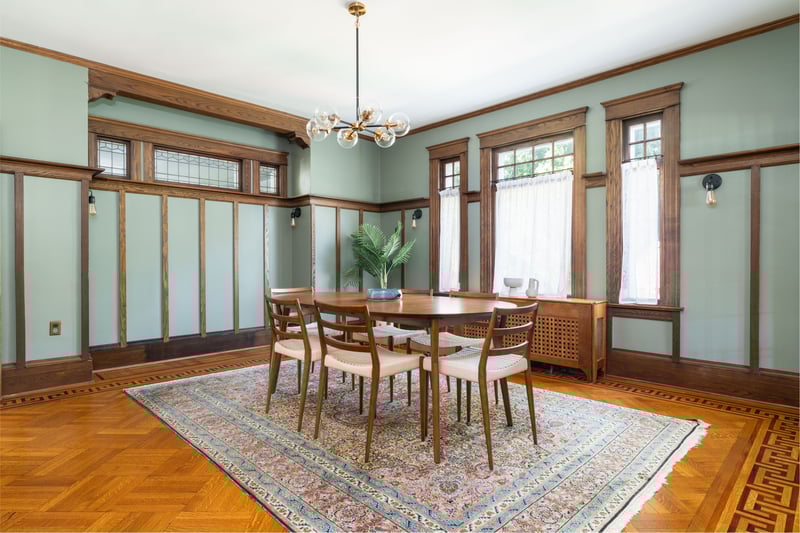 Dining room featuring a chandelier, ornamental molding, and radiator