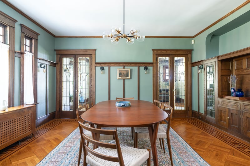Dining room featuring french doors, ornamental molding, radiator heating unit, and a chandelier