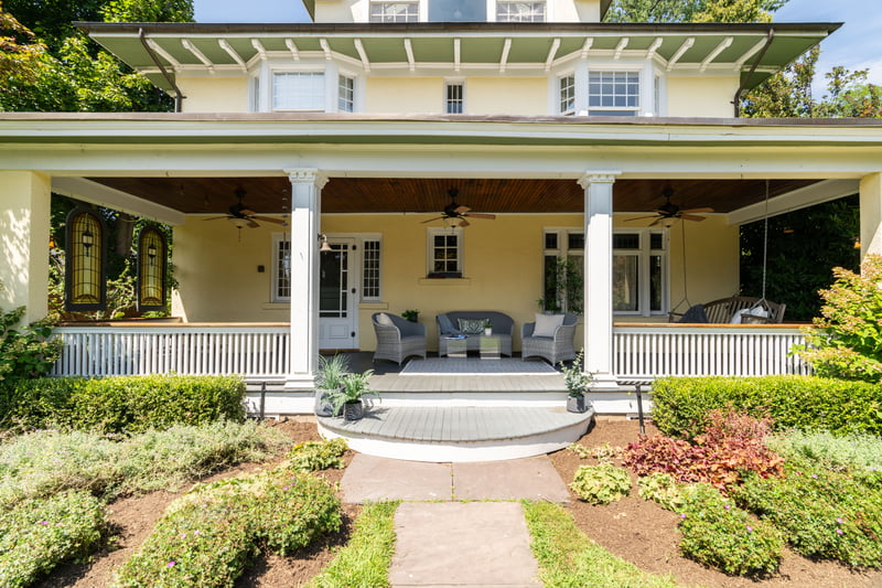 Entrance to property featuring an outdoor living space, a porch, and stucco siding