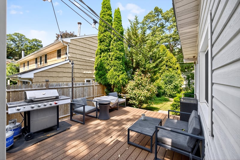 Beautiful Trex Deck featuring grilling area and view of large yard