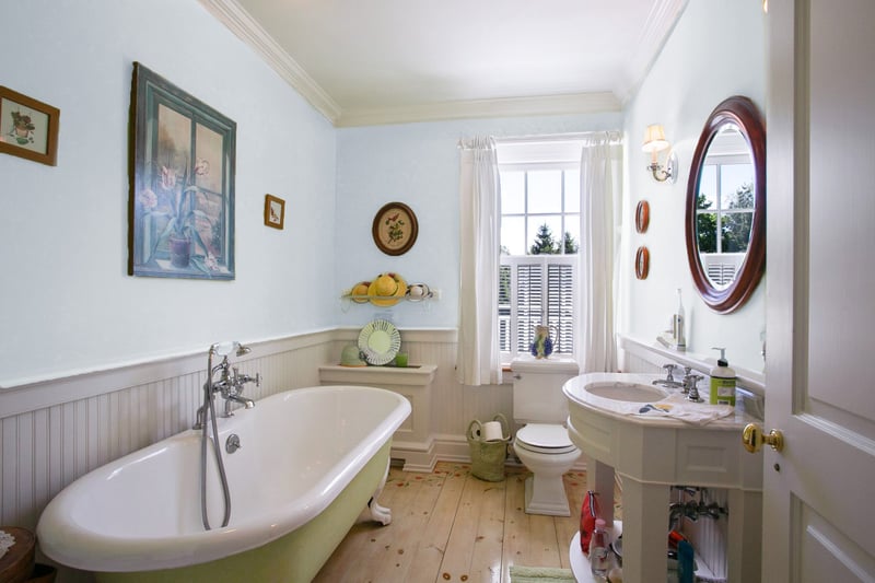 Second floor hall bath with stand-alone Claw foot tub.