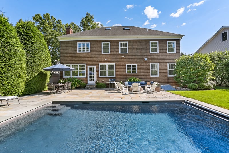 Back view of house and pool. Completely fenced in.