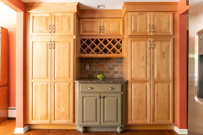 Kitchen area featuring ample cabinet space and wine rack.