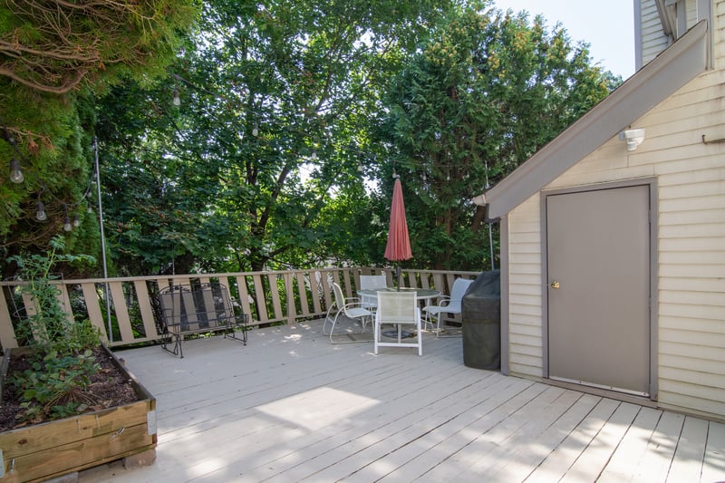 Deck with outdoor dining area and area for grilling....