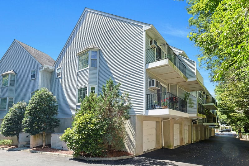 #16 is a sought after end unit duplex, far from the road. Both bay windows, both balconies, and the end garage, are yours!