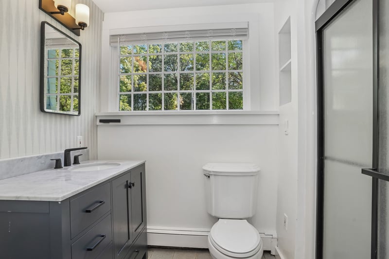 Updated full bath adjacent to den/playroom