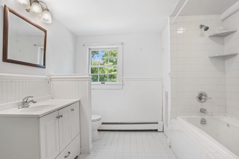 Spacious updated full bathroom on upper level