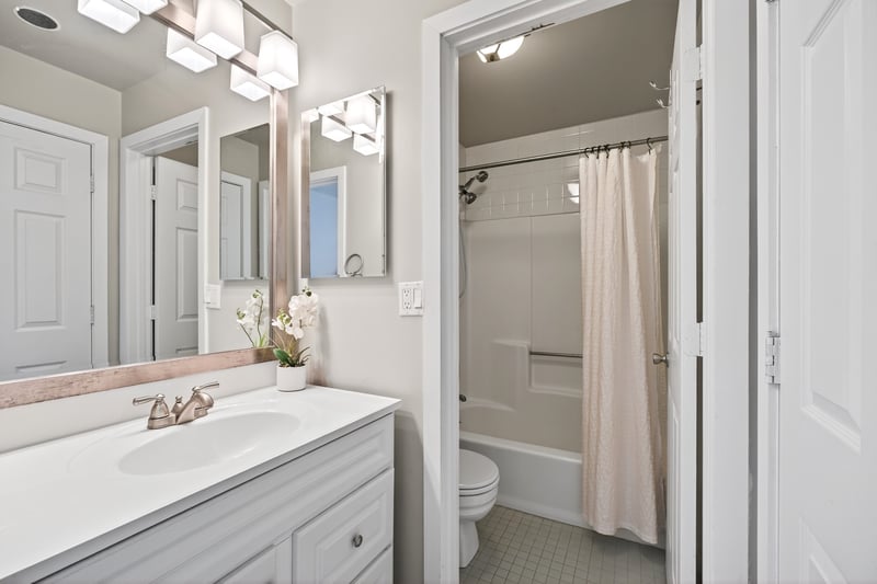 Full bath with shower / tub combo, vanity, and linen closet...