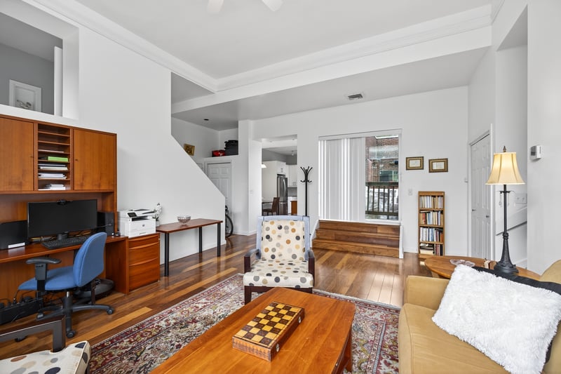 Living Room with hardwood / wood-style flooring and ceiling fan