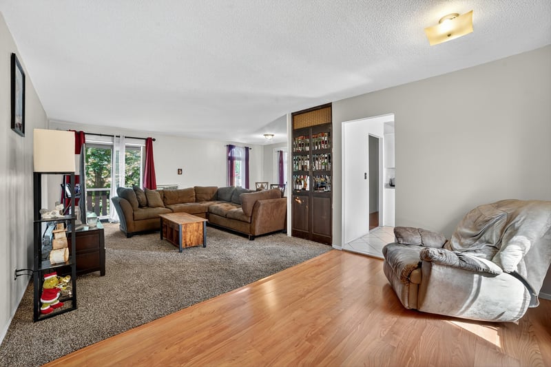 Living room with wood finished floors and a textured ceiling