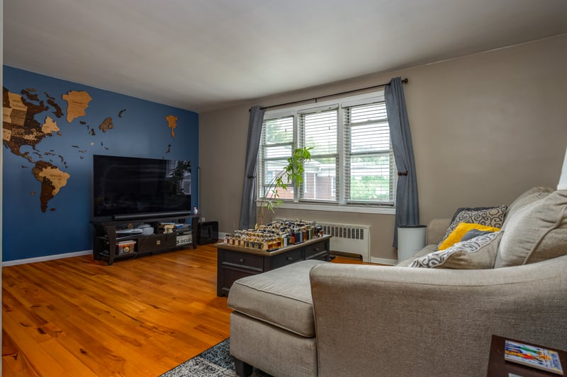 Living room featuring wood finished floors and baseboards