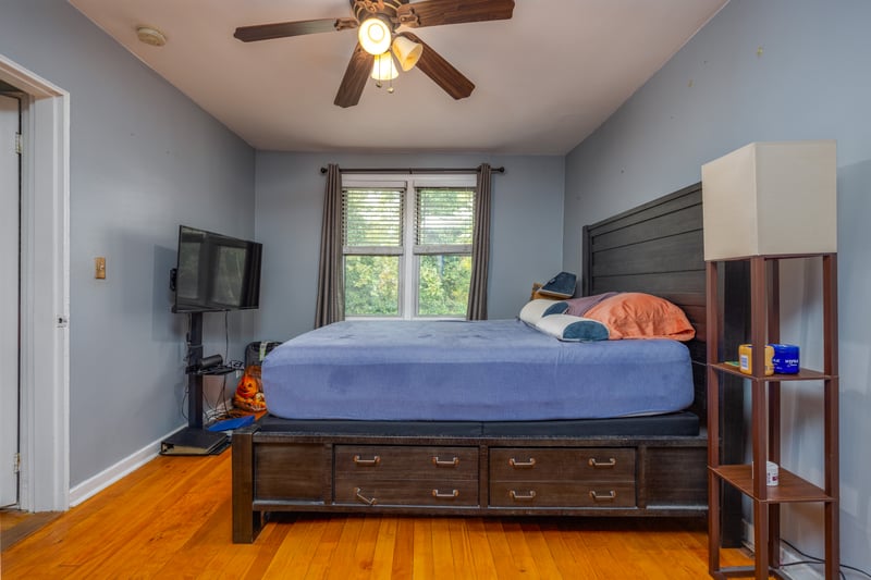Bedroom featuring light wood-style flooring and ceiling fan