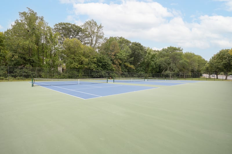 View of tennis court featuring community basketball court