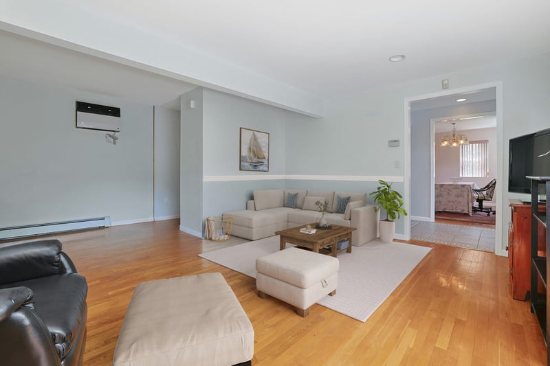 Virtual Staging of Living Room with foyer and dining room beyond.