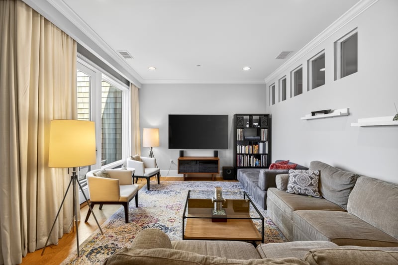 Living area with hardwood floors, and recessed lighting...