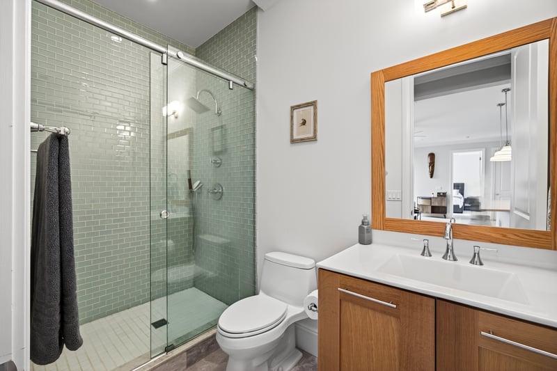 Bathroom featuring vanity and a stall shower