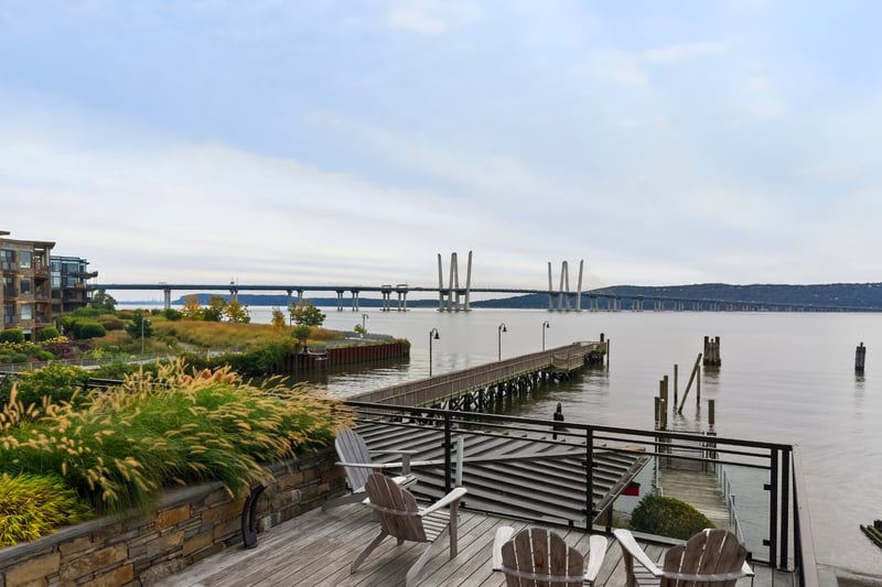 Dock area featuring a water view