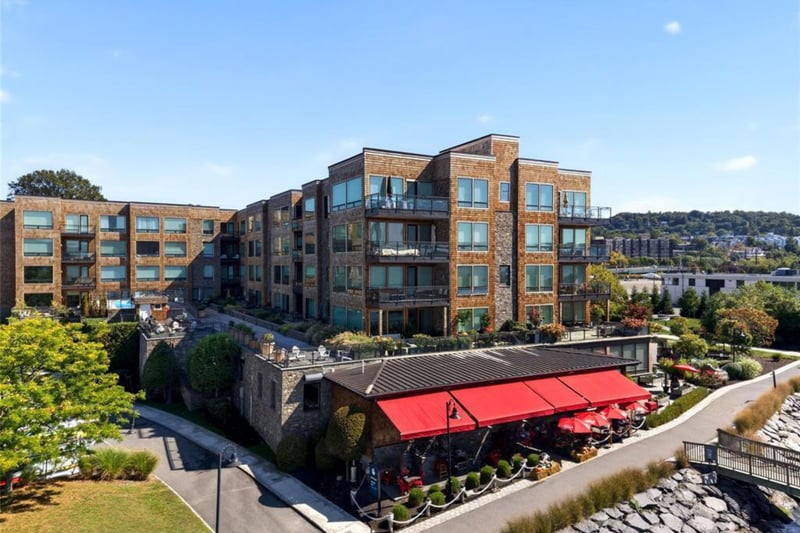 View of apartment building and Farmer and the Fish Restaurant...
