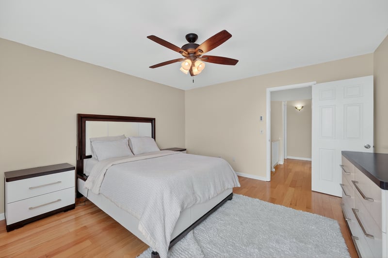 Bedroom featuring light wood finished floors and ceiling fan
